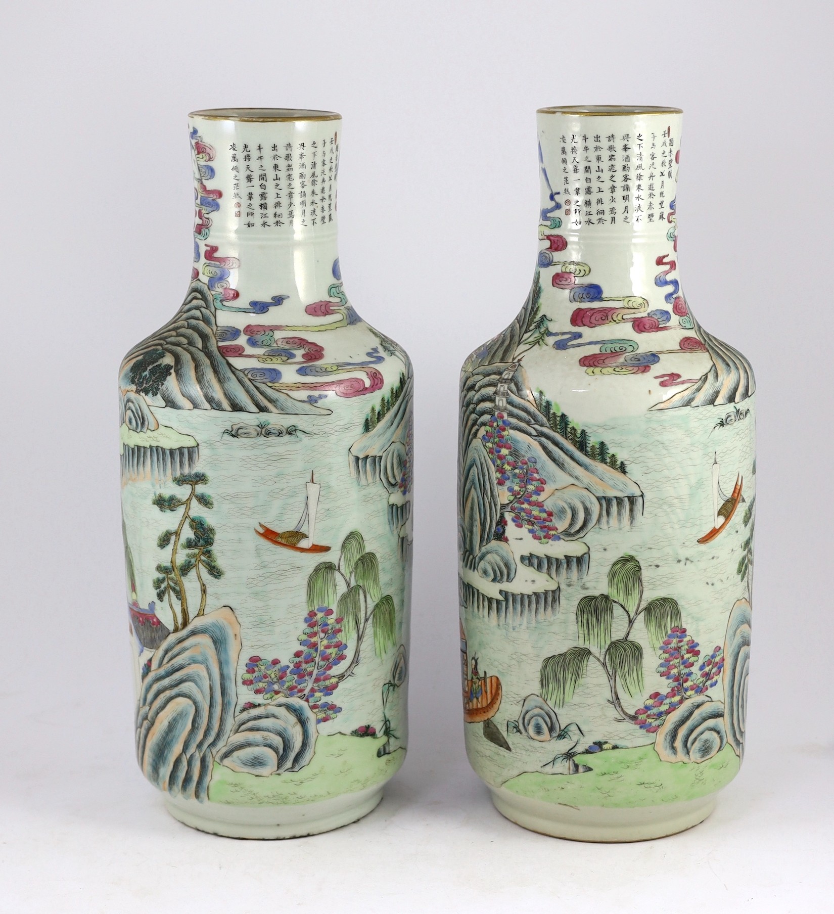 A pair of Chinese famille rose fencai inscribed vases, mid 19th century, 45cm high, cracks to neck of one vase